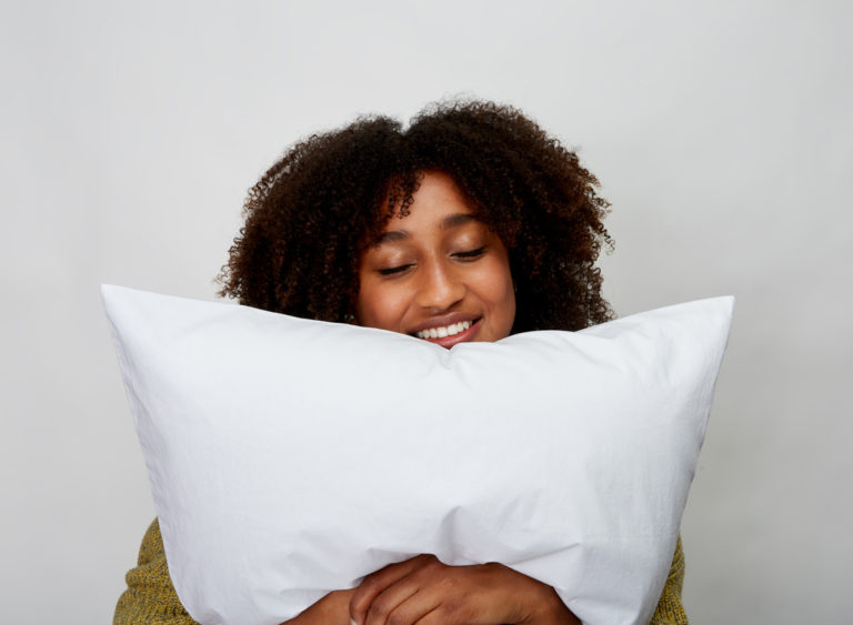 woman holding pillow